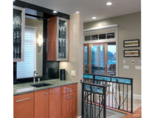 Bar area with lighted glass cabinets - Home on the Lake