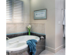 Bathroom tub with mosaic tile - Home on the Lake